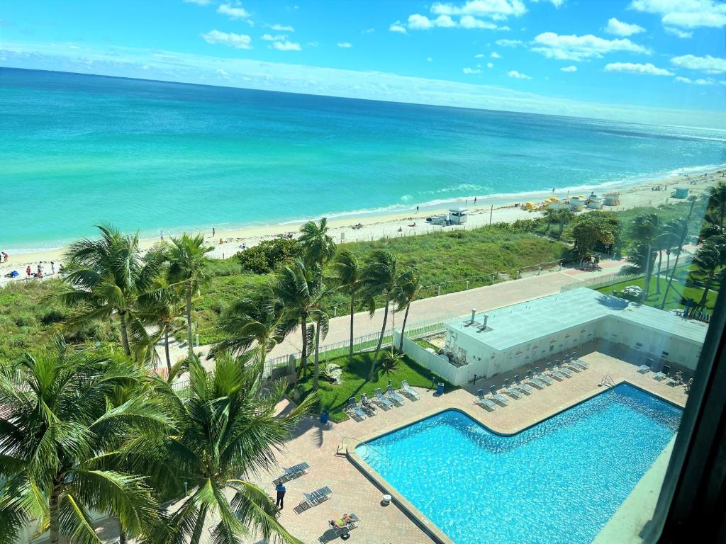 an aerial view of a resort with a swimming pool and the beach at Ocean Front Units at Miami Beach in Miami Beach