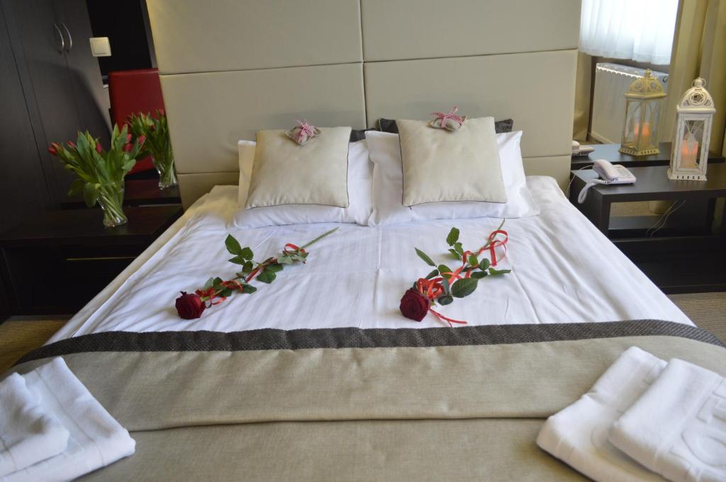 Postel nebo postele na pokoji v ubytování Hotel Ajax