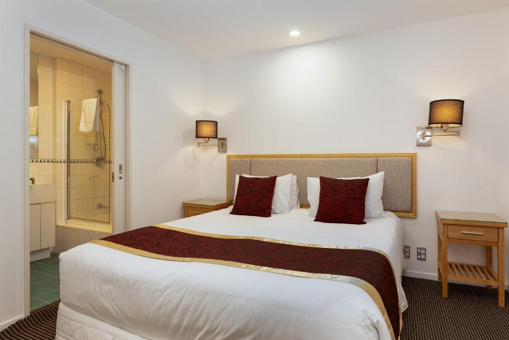 Postel nebo postele na pokoji v ubytování Fino Hotel & Suites