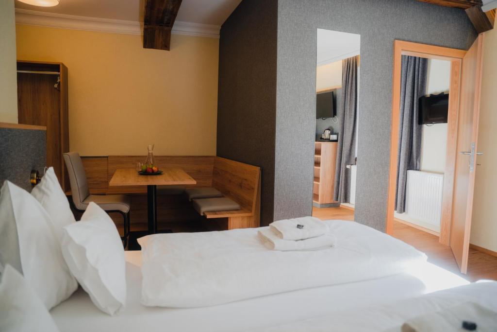 Postel nebo postele na pokoji v ubytování Hotel Restaurant DAS RÖSSL
