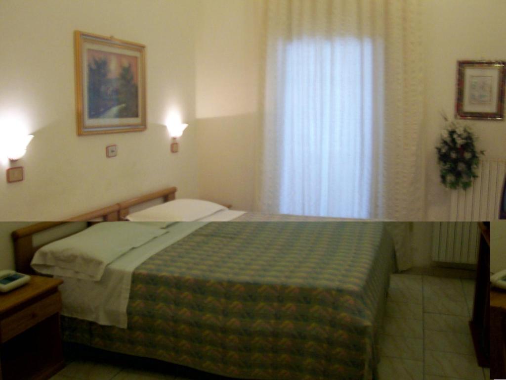 Postel nebo postele na pokoji v ubytování Hotel Pensione Romeo