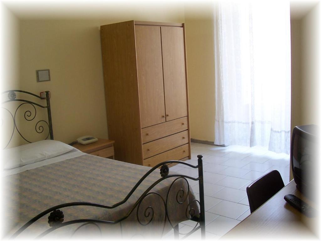 Postel nebo postele na pokoji v ubytování Hotel Pensione Romeo