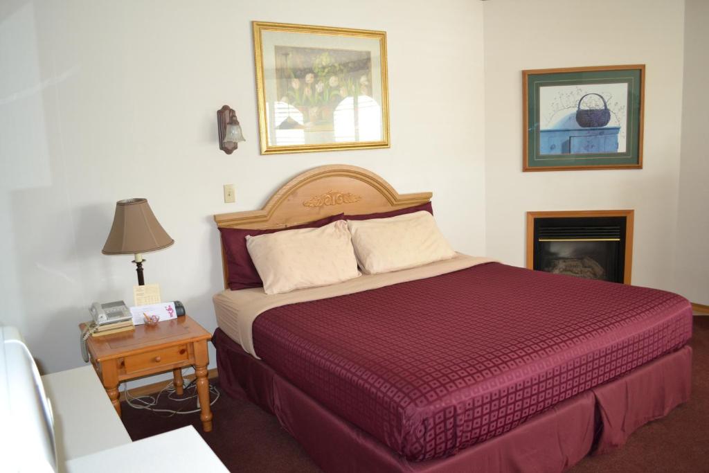 Postel nebo postele na pokoji v ubytování Anaco Bay Inn