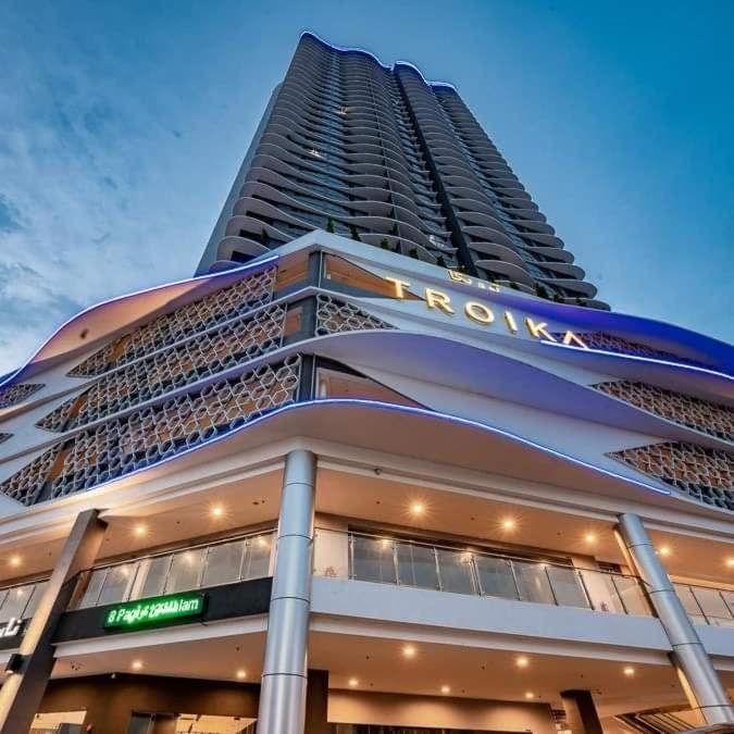 a large building with a sign on the side of it at Triple D @ Troika Residence in Kota Bharu