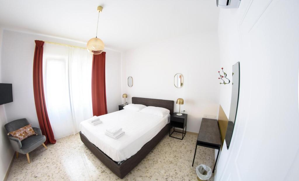 Ένα ή περισσότερα κρεβάτια σε δωμάτιο στο I Sogni della Regina