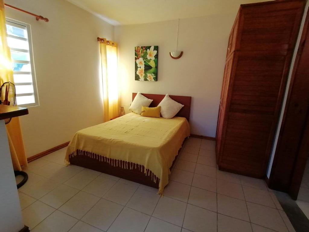 Postel nebo postele na pokoji v ubytování Terre et Mer - Studios - Ile Maurice