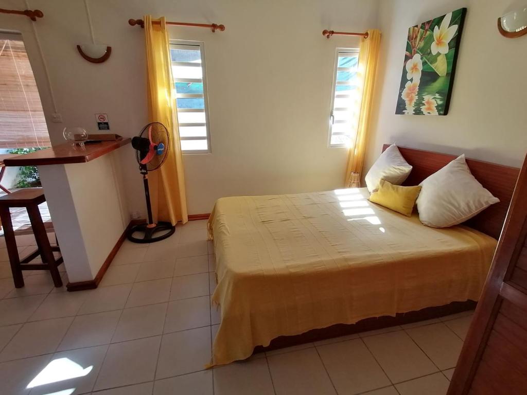 Postel nebo postele na pokoji v ubytování Terre et Mer - Studios - Ile Maurice
