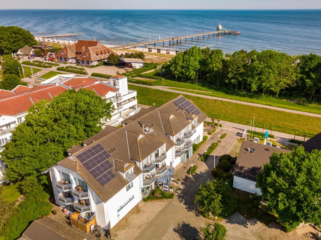 an aerial view of a house with solar panels on its roof at Hotel & Restaurant Seebrücke in Zingst