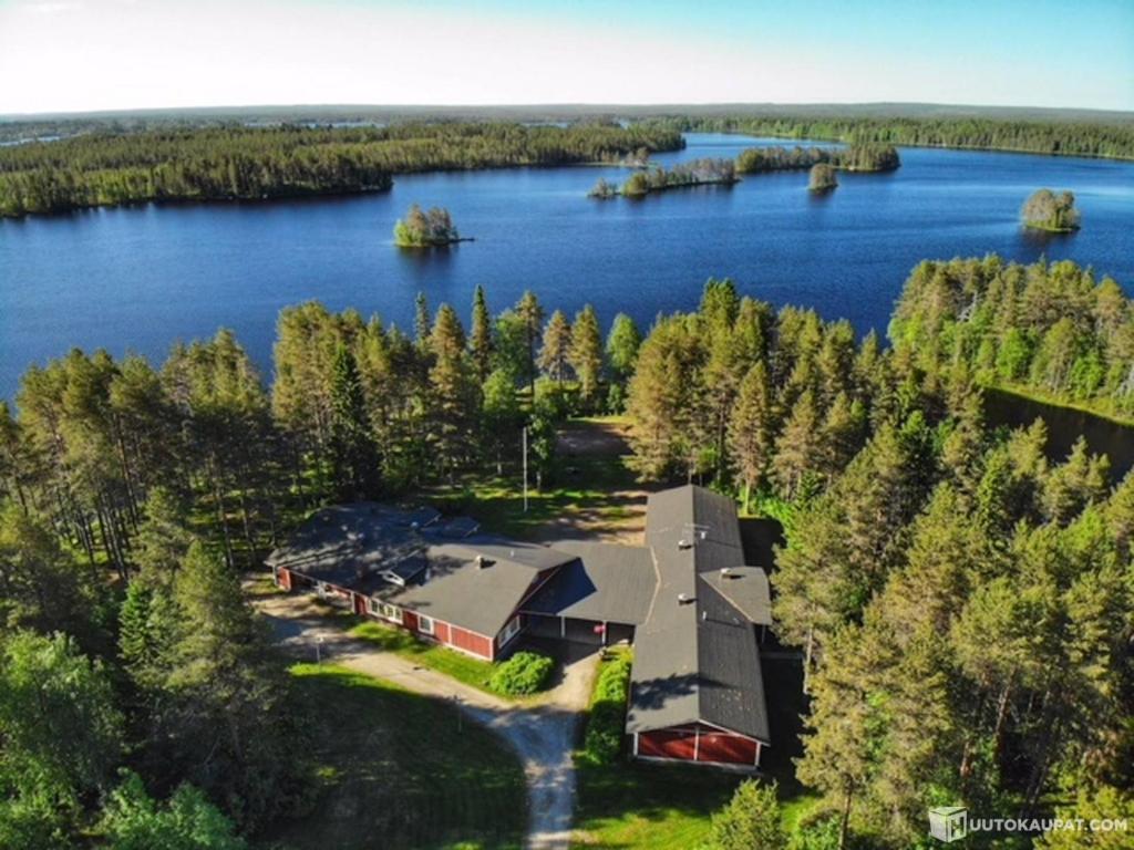 an aerial view of a house on a island in a lake at NORDIC LAKES OY/AB in Taivalkoski