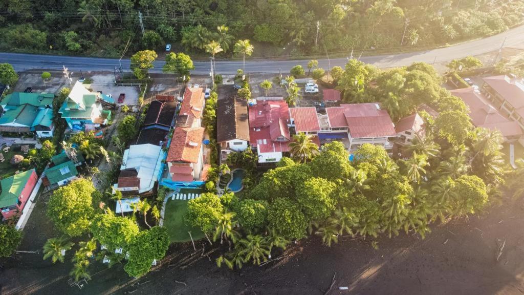 an aerial view of a resort with trees and a road at Surf Inn Hermosa in Playa Hermosa