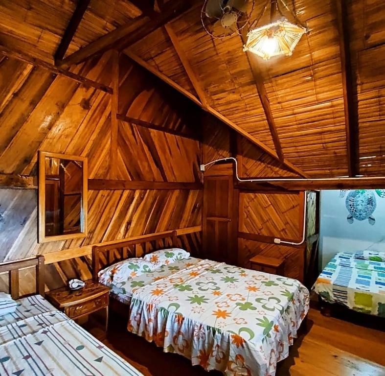 Postel nebo postele na pokoji v ubytování Hostal Mirada al Mar
