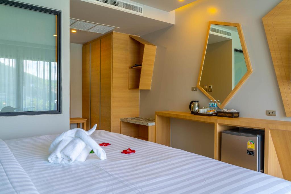 Postel nebo postele na pokoji v ubytování Golden Paradise Hotel - SHA PLUS