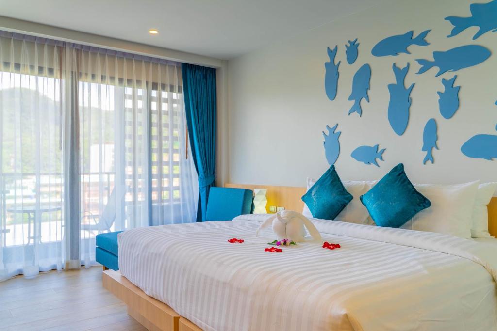 Postel nebo postele na pokoji v ubytování Golden Paradise Hotel - SHA PLUS