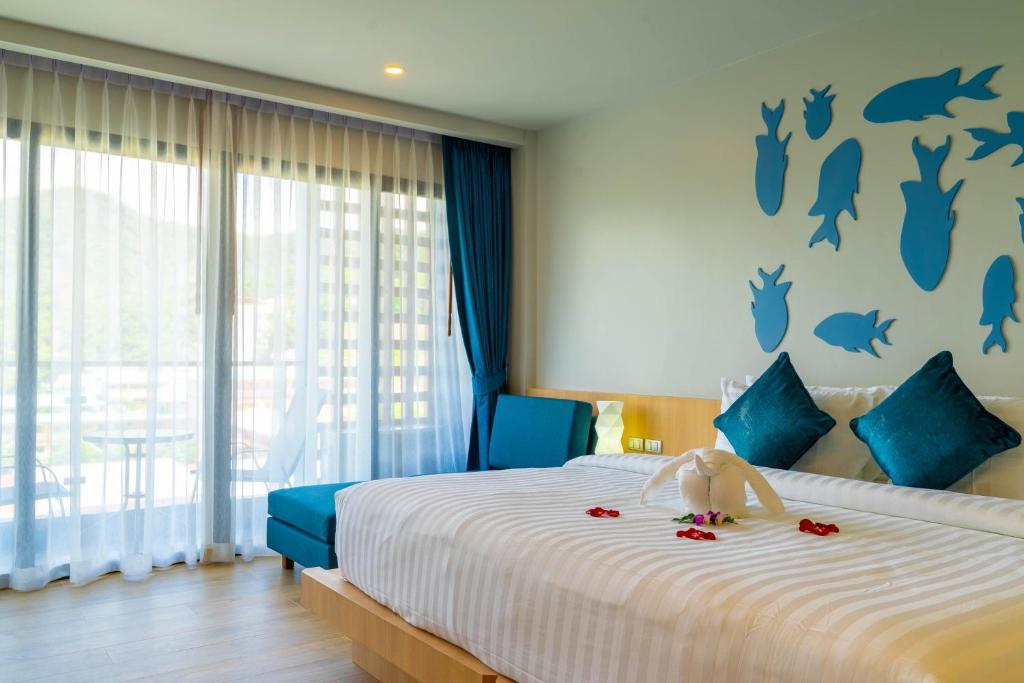 Postel nebo postele na pokoji v ubytování Golden Paradise Hotel - SHA PLUS