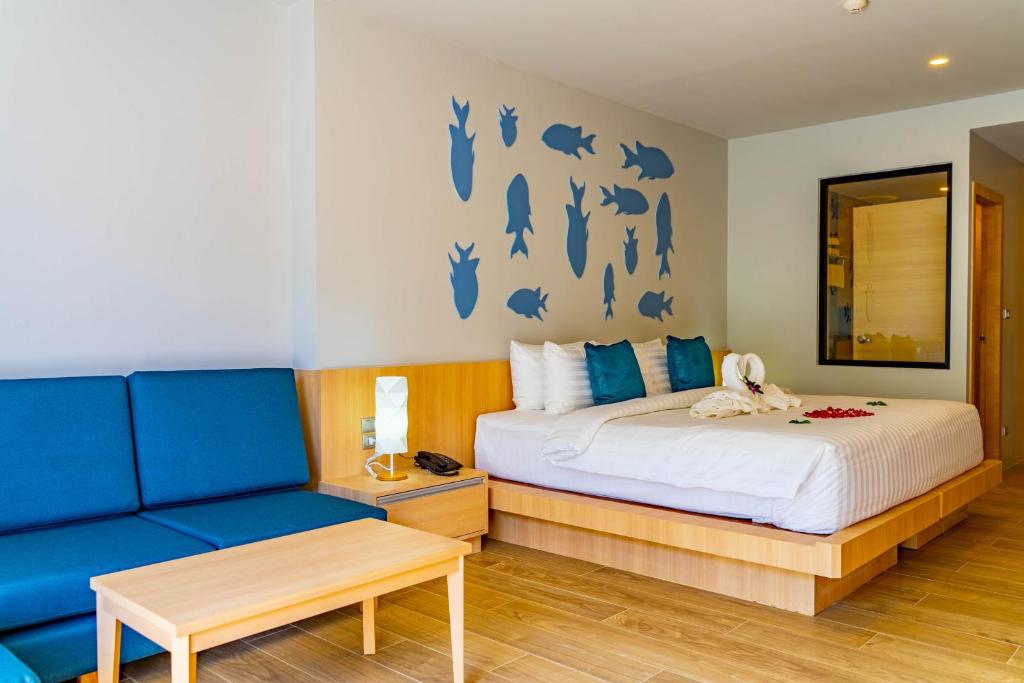 Postel nebo postele na pokoji v ubytování Golden Paradise Hotel - SHA PLUS