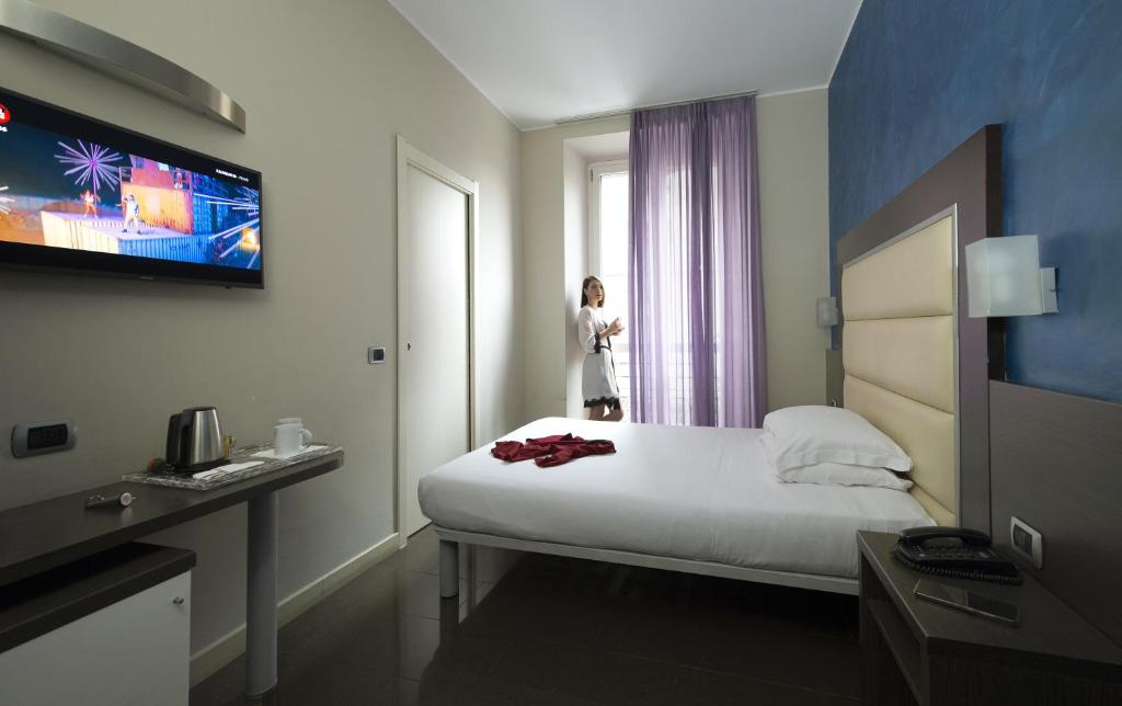Postel nebo postele na pokoji v ubytování Hotel Five