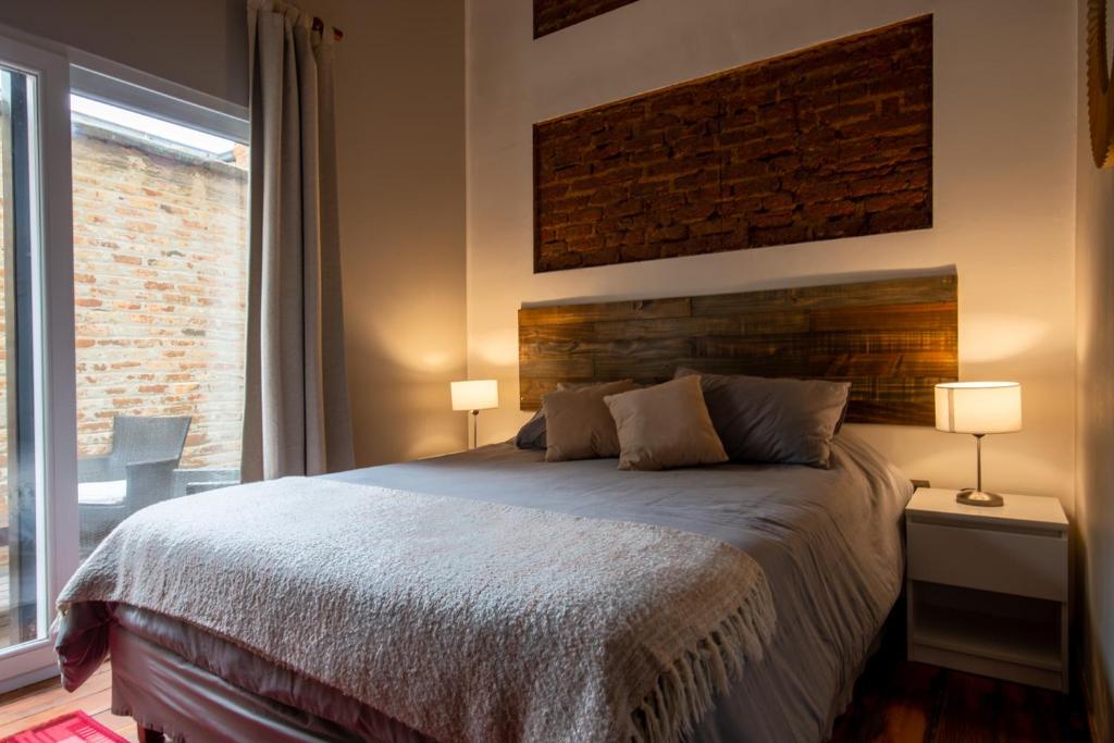 Postel nebo postele na pokoji v ubytování BO Hotel & Terraza