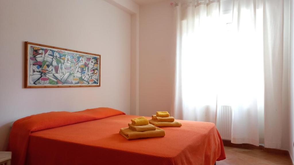 Postel nebo postele na pokoji v ubytování Bed and Breakfast Dorgali