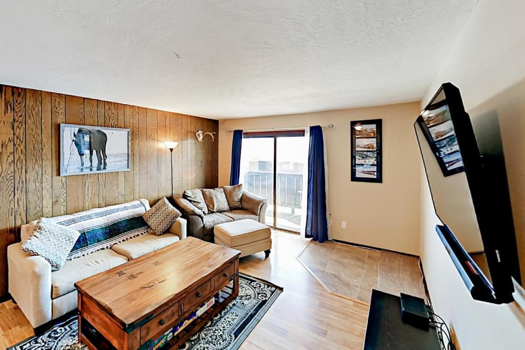 a living room with a couch and a table at Mountian View Condo Unit S303 in Dillon