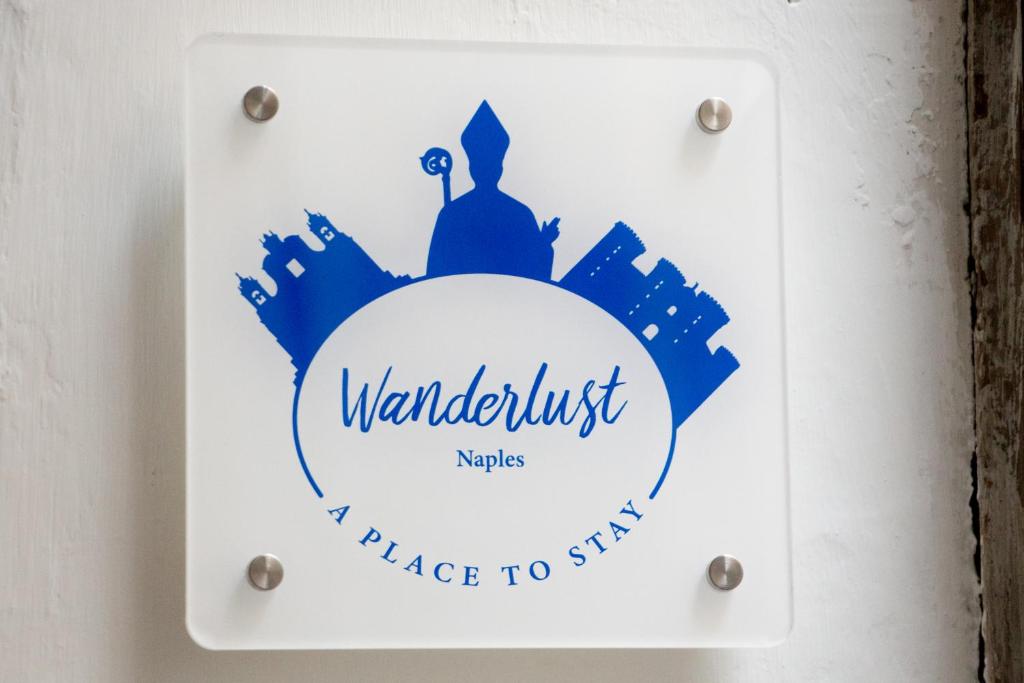 WANDERLUST NAPLES a place to stayに飾ってある許可証、賞状、看板またはその他の書類