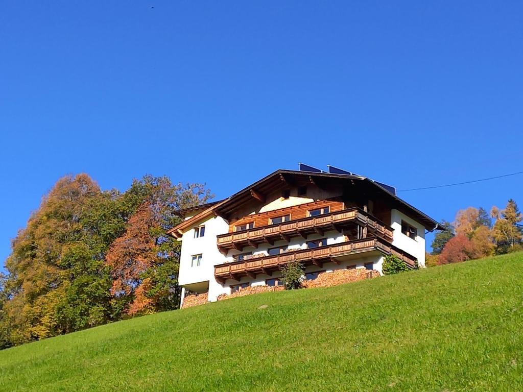 a building on the side of a hill at Ferienwohnung Dengg in Stummerberg