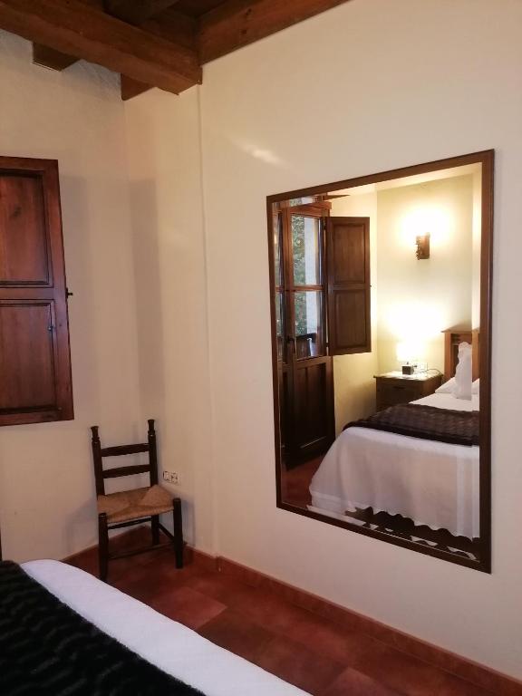 Cama o camas de una habitación en Complejo Rural Las Palomas