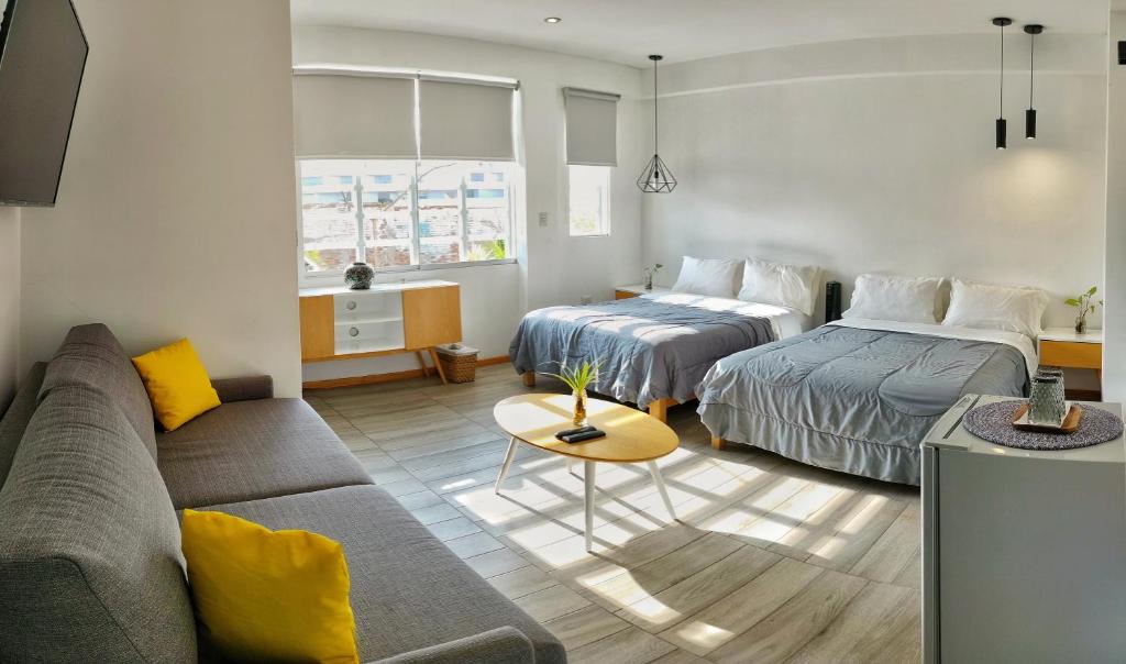 Postel nebo postele na pokoji v ubytování Kauhuhu Casa Hotel