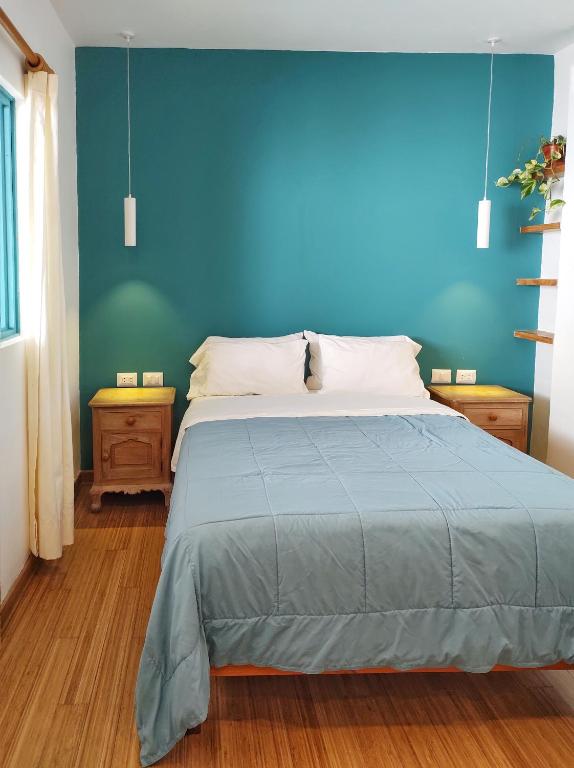 Postel nebo postele na pokoji v ubytování Kauhuhu Casa Hotel