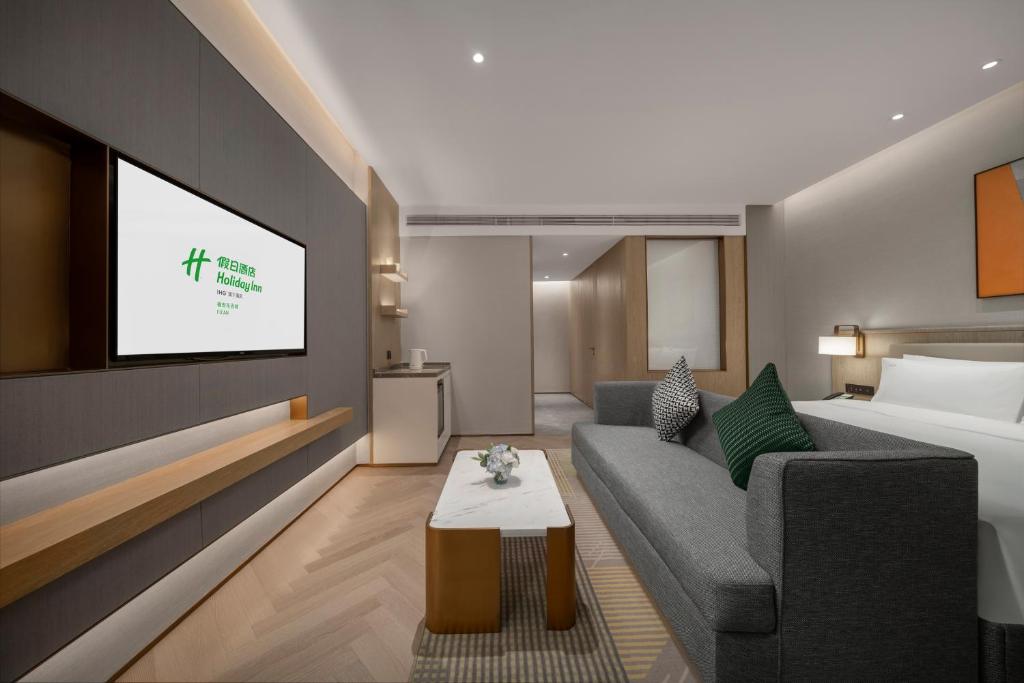 Postel nebo postele na pokoji v ubytování Holiday Inn Fu'an
