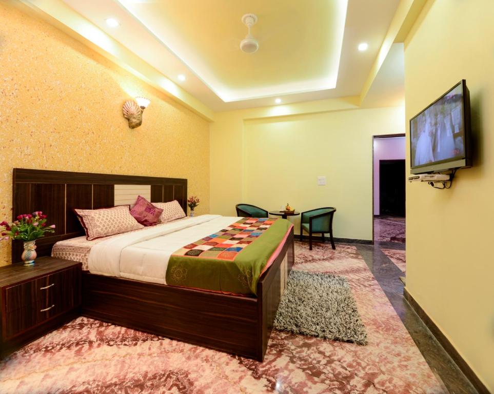 Postel nebo postele na pokoji v ubytování Rainbow Home Stay