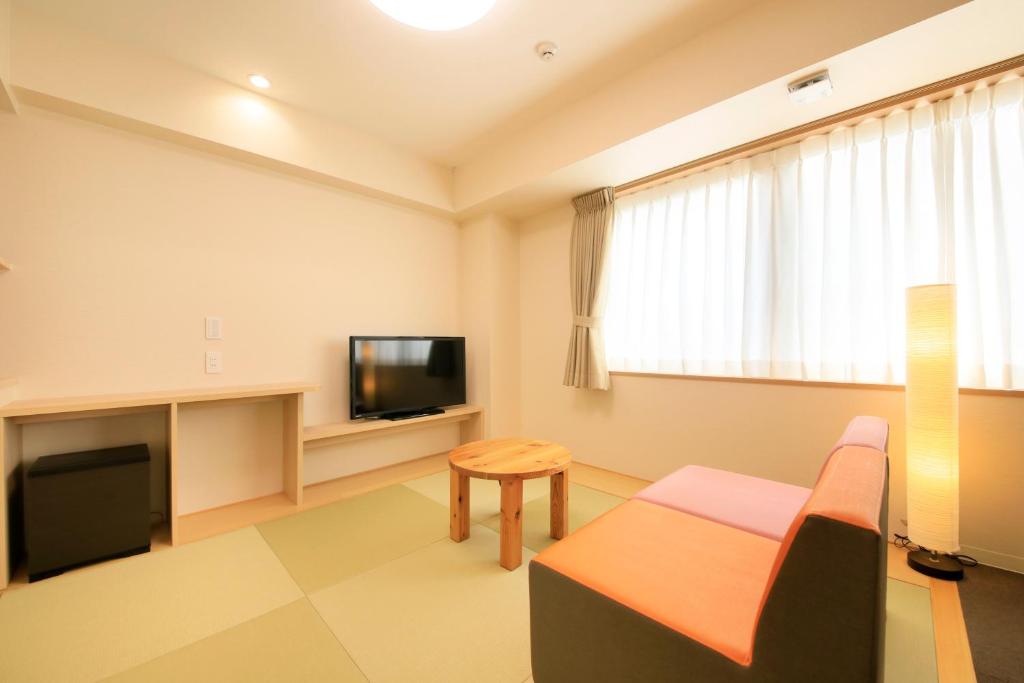 TV a/nebo společenská místnost v ubytování Hotel Showmeikan