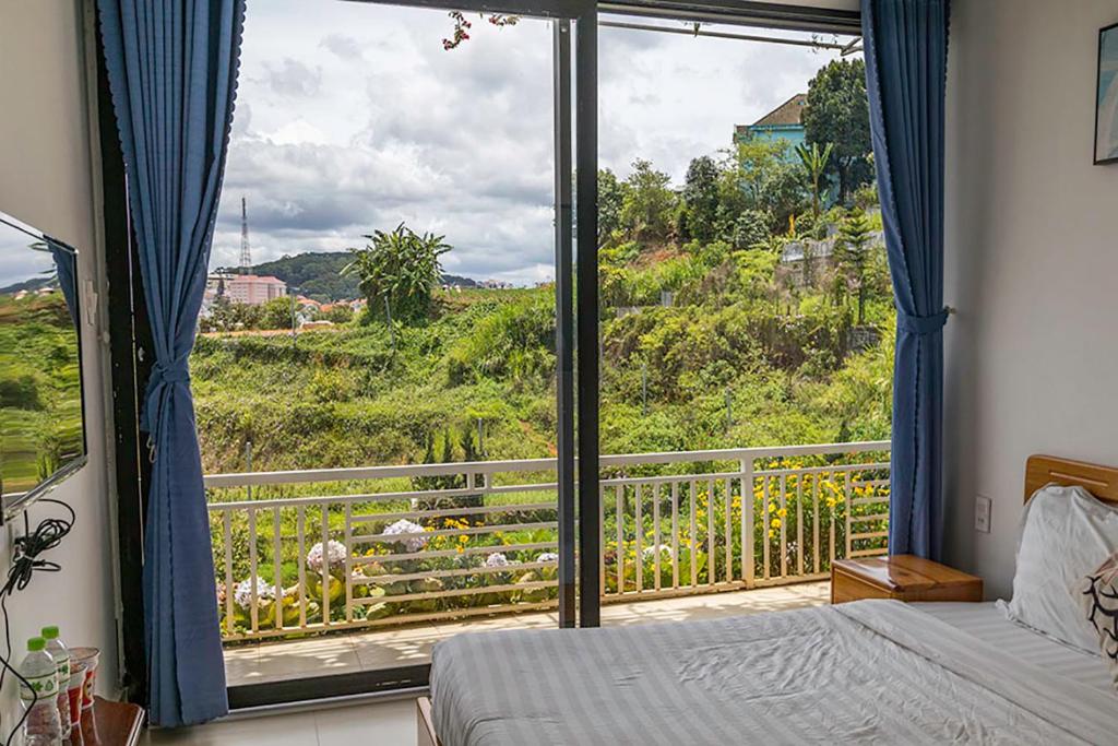 Postel nebo postele na pokoji v ubytování An Garden Dalat