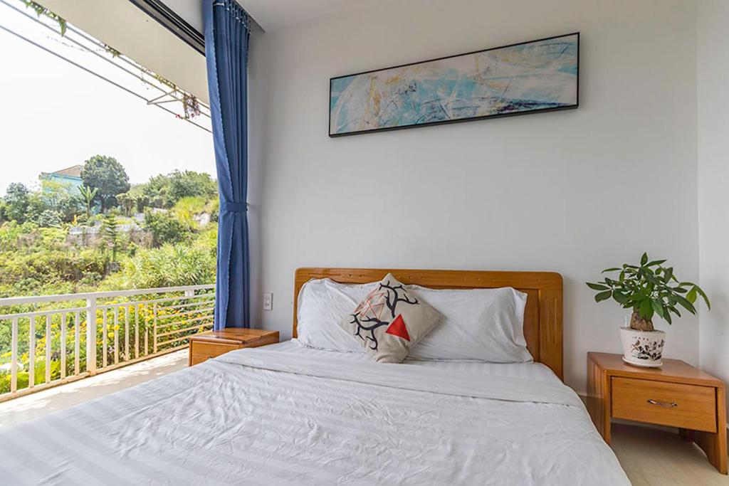 Postel nebo postele na pokoji v ubytování An Garden Dalat