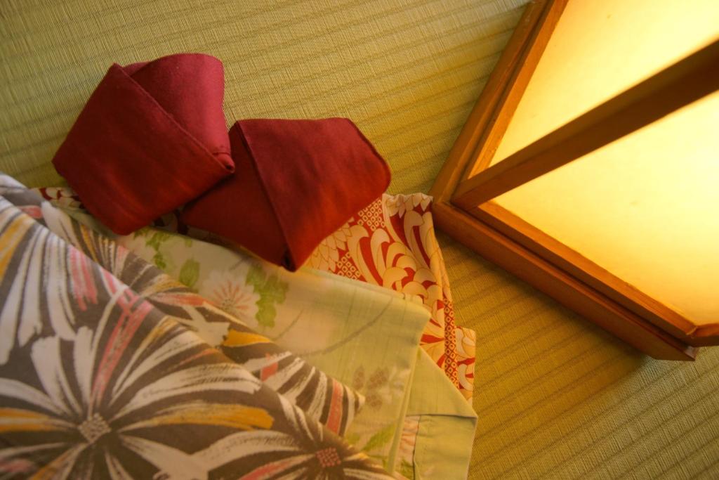 Postel nebo postele na pokoji v ubytování Hotel Kaminoyu Onsen