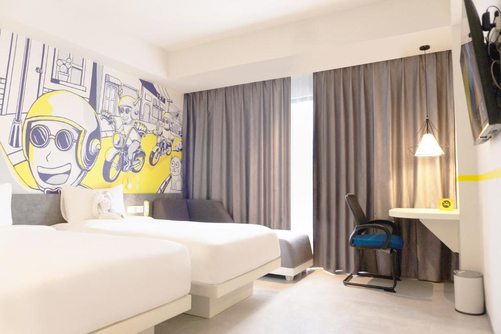 Postel nebo postele na pokoji v ubytování Yello Hotel Jambi