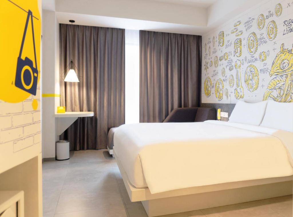 Postel nebo postele na pokoji v ubytování Yello Hotel Jambi
