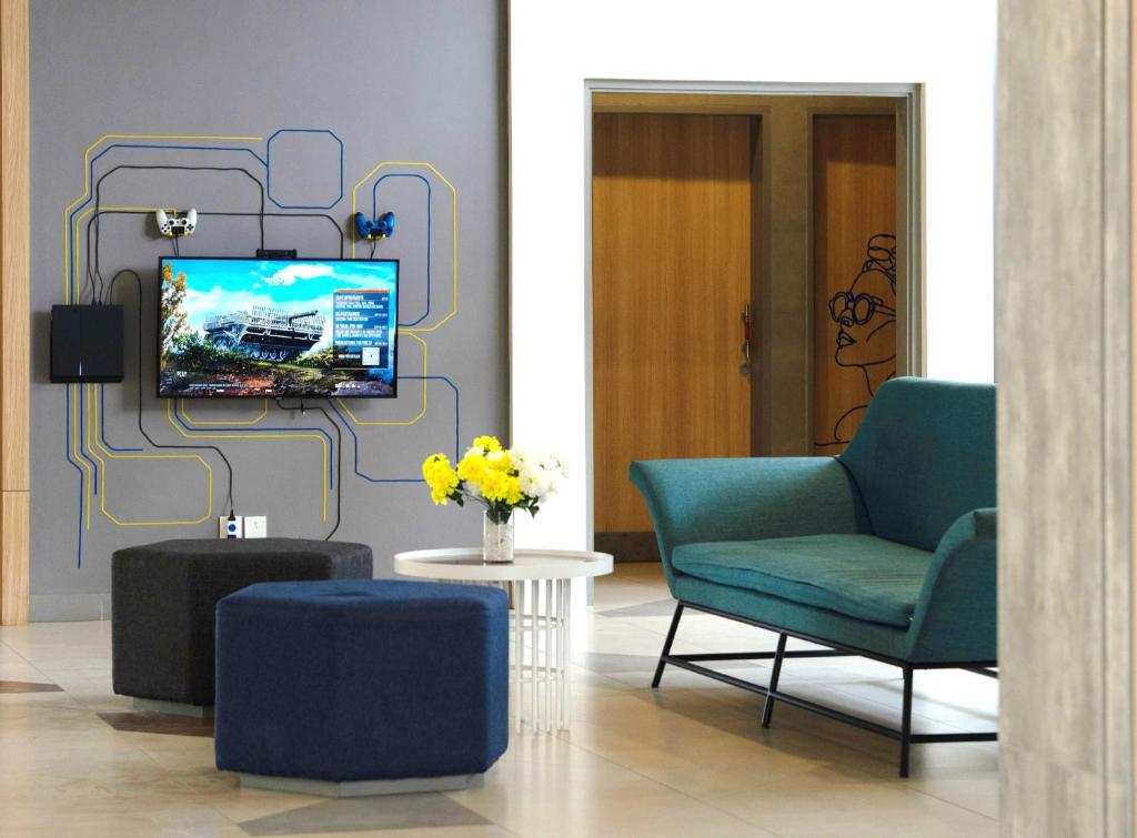 TV a/nebo společenská místnost v ubytování Yello Hotel Jambi
