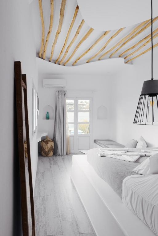Postel nebo postele na pokoji v ubytování Alidian bay Suites Leros