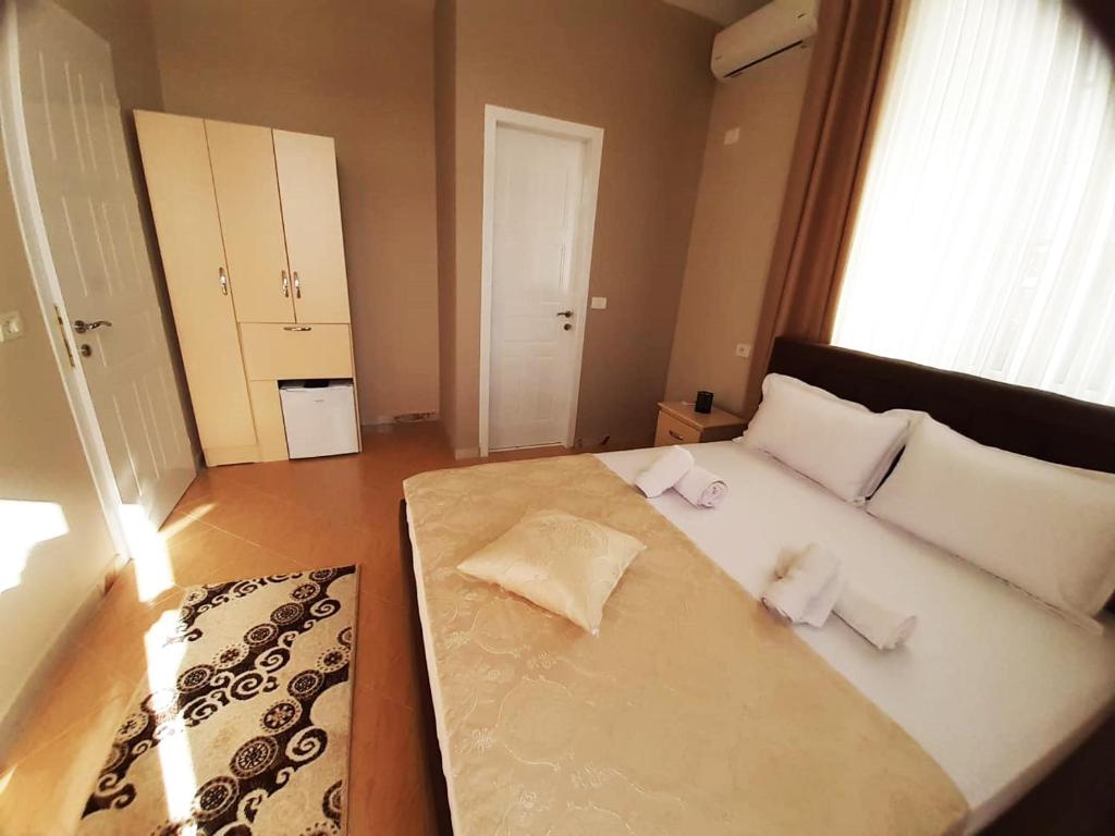 Postel nebo postele na pokoji v ubytování KU&NA HOTEL BELSH