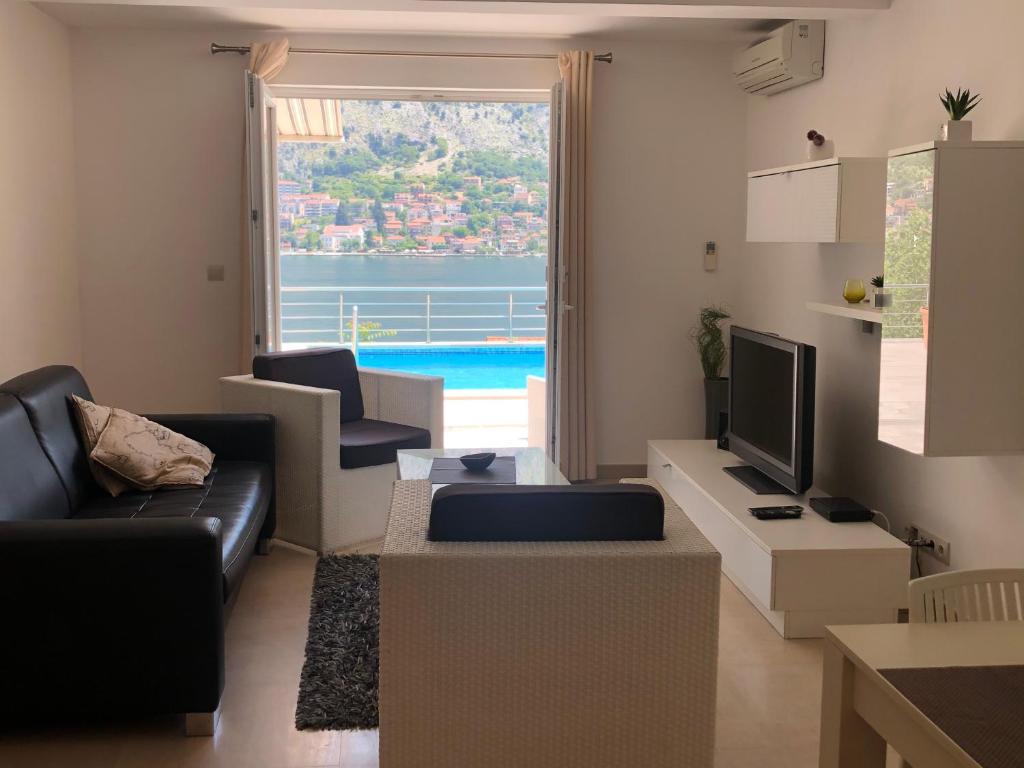 TV a/nebo společenská místnost v ubytování Muo Apartments