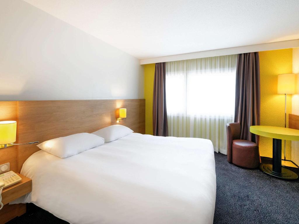 Postel nebo postele na pokoji v ubytování ibis Styles Chalon sur Saône