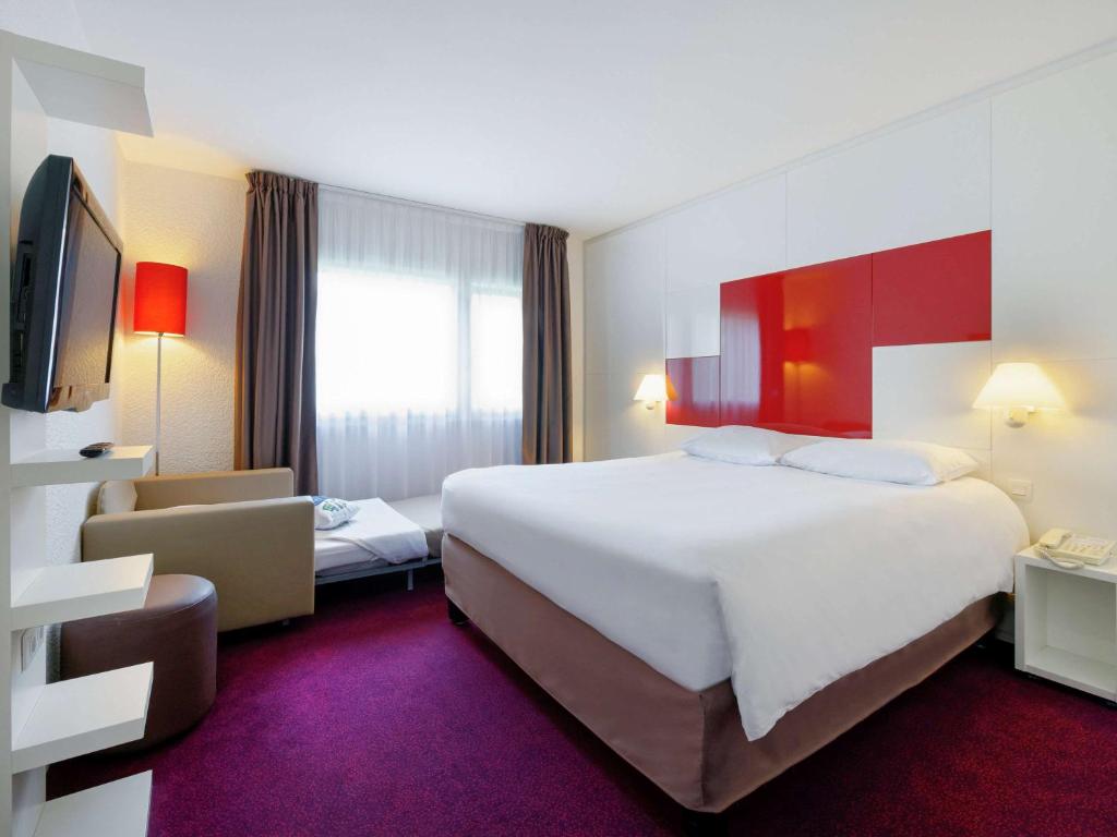 Postel nebo postele na pokoji v ubytování ibis Styles Chalon sur Saône