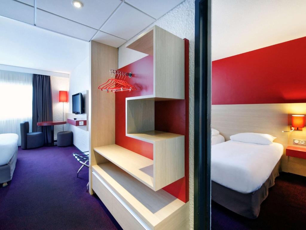 Postel nebo postele na pokoji v ubytování ibis Styles Chalon sur Saône
