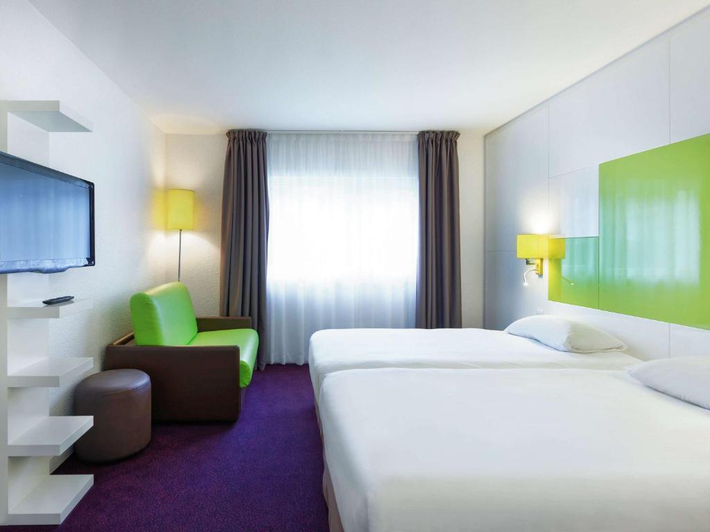 Postel nebo postele na pokoji v ubytování ibis Styles Chalon sur Saône