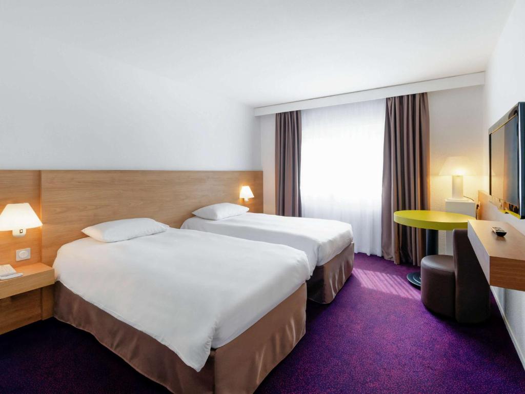Postel nebo postele na pokoji v ubytování ibis Styles Chalon sur Saône