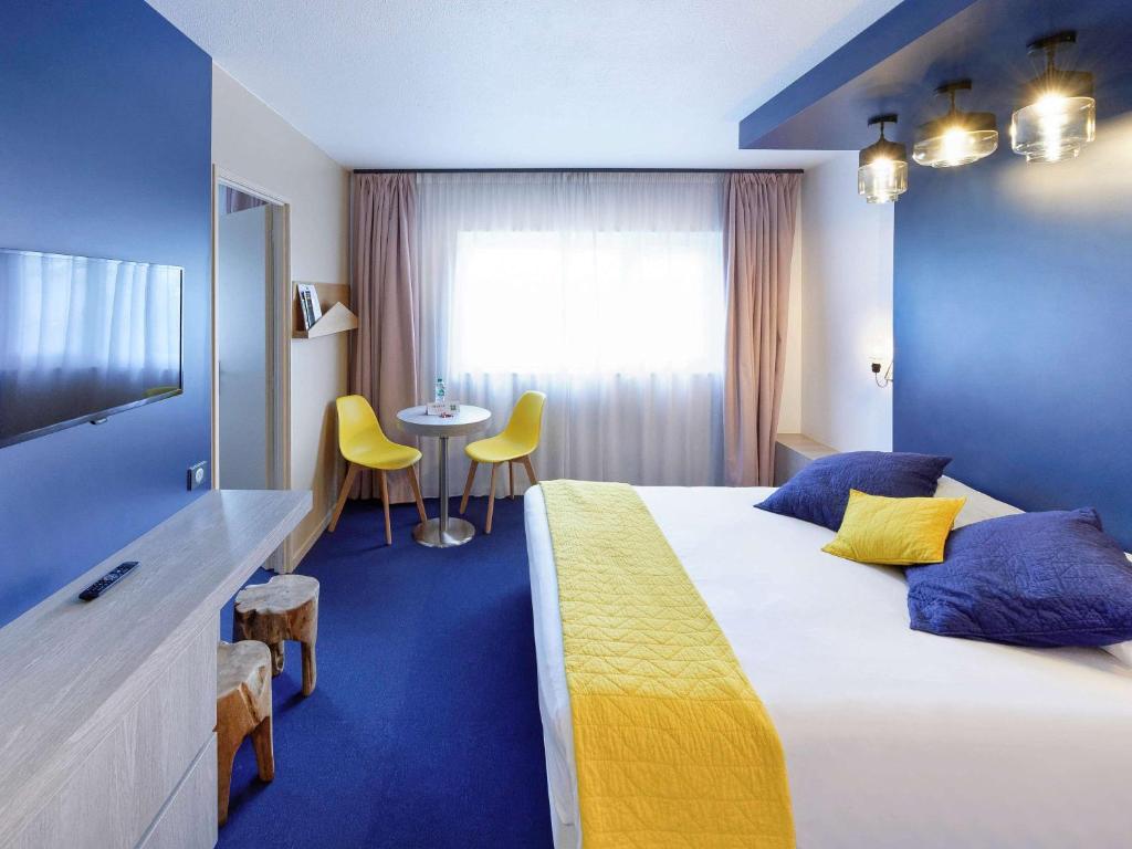 Postel nebo postele na pokoji v ubytování ibis Styles Chalon sur Saône