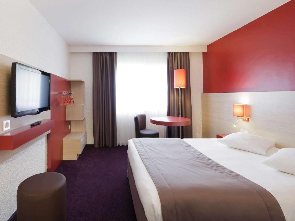 Postel nebo postele na pokoji v ubytování ibis Styles Chalon sur Saône