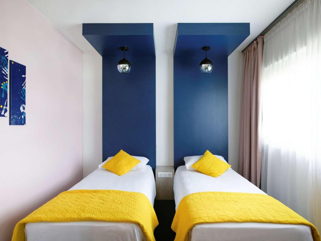 Postel nebo postele na pokoji v ubytování ibis Styles Chalon sur Saône
