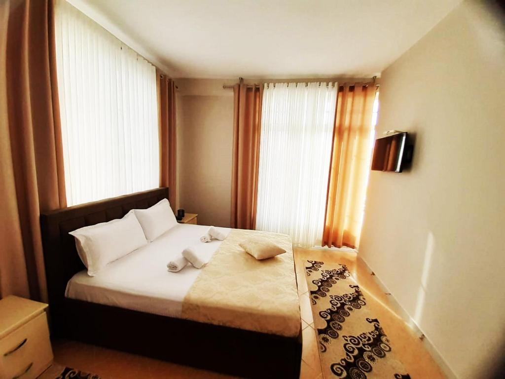 Postel nebo postele na pokoji v ubytování KU&NA HOTEL BELSH
