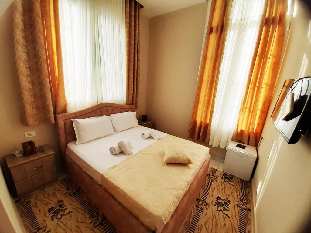 Postel nebo postele na pokoji v ubytování KU&NA HOTEL BELSH